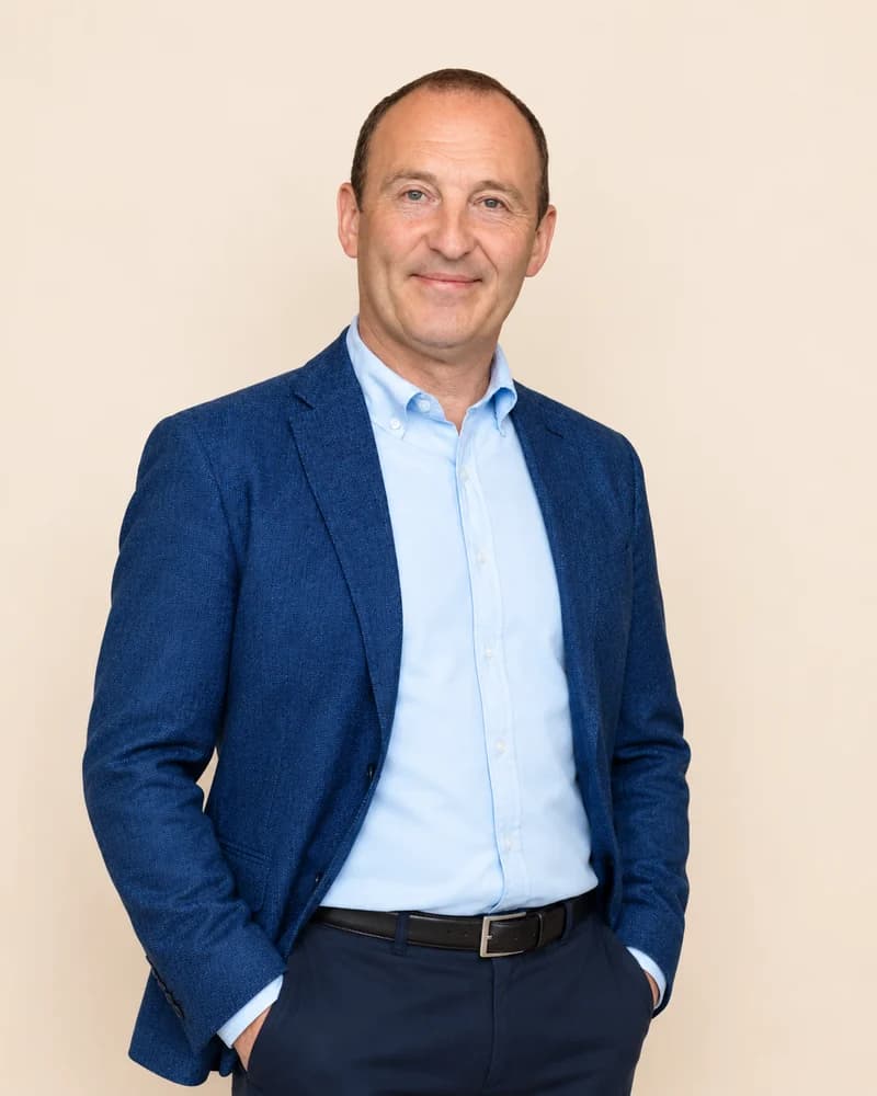 Paul Riley, Honorary Business Advisor to DekNurse, in a blue blazer